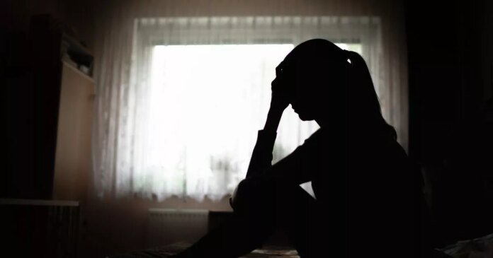 0_silhouette-of-a-woman-sitting-on-bed-feeling-sleepless-suffering-from-emotional-stress