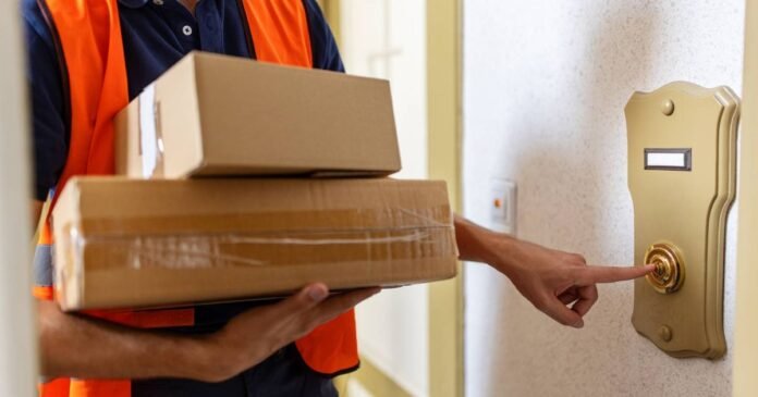 1_postal-worker-doing-a-home-delivery-of-parcel